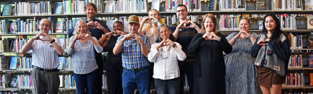 BRLD Staff with hands making heart shapes. 2025